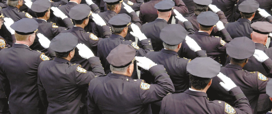 Police Department Members Doing a Salute at a  Funeral